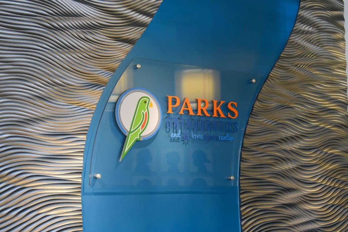 Parks Orthodontics Front Desk and Business Sign in Tabb VA Front desk at Parks Orthodontics in Tabb VA with business sign displayed