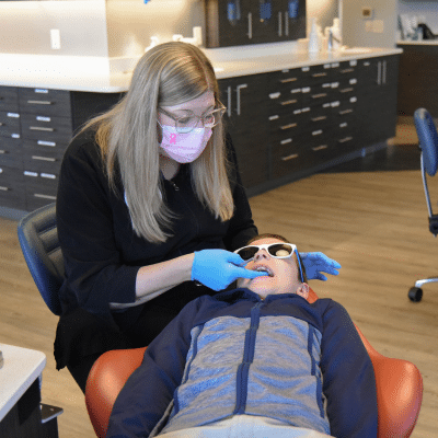 Dr. Meredith Parks working on a patient's teeth, representing orthodontic care in Yorktown VA