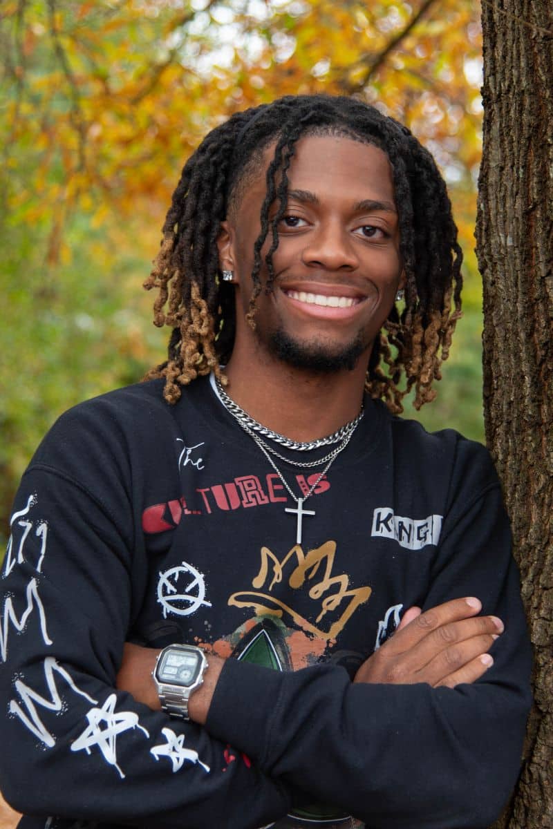 Beaux smiling in a black graphic long sleeve shirt at Parks Orthodontics