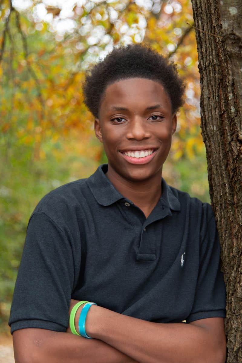 Jacob smiling in a black shirt at Parks Orthodontics