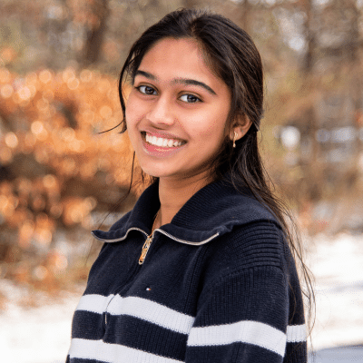 Teenage girl smiling, representing how Invisalign saves time compared to braces
